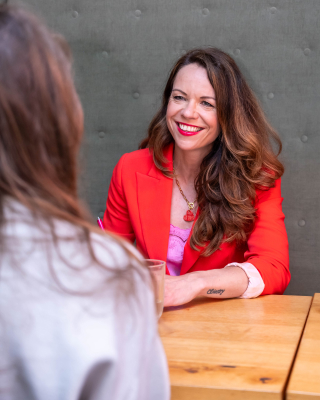 Sylvia coaching at a table